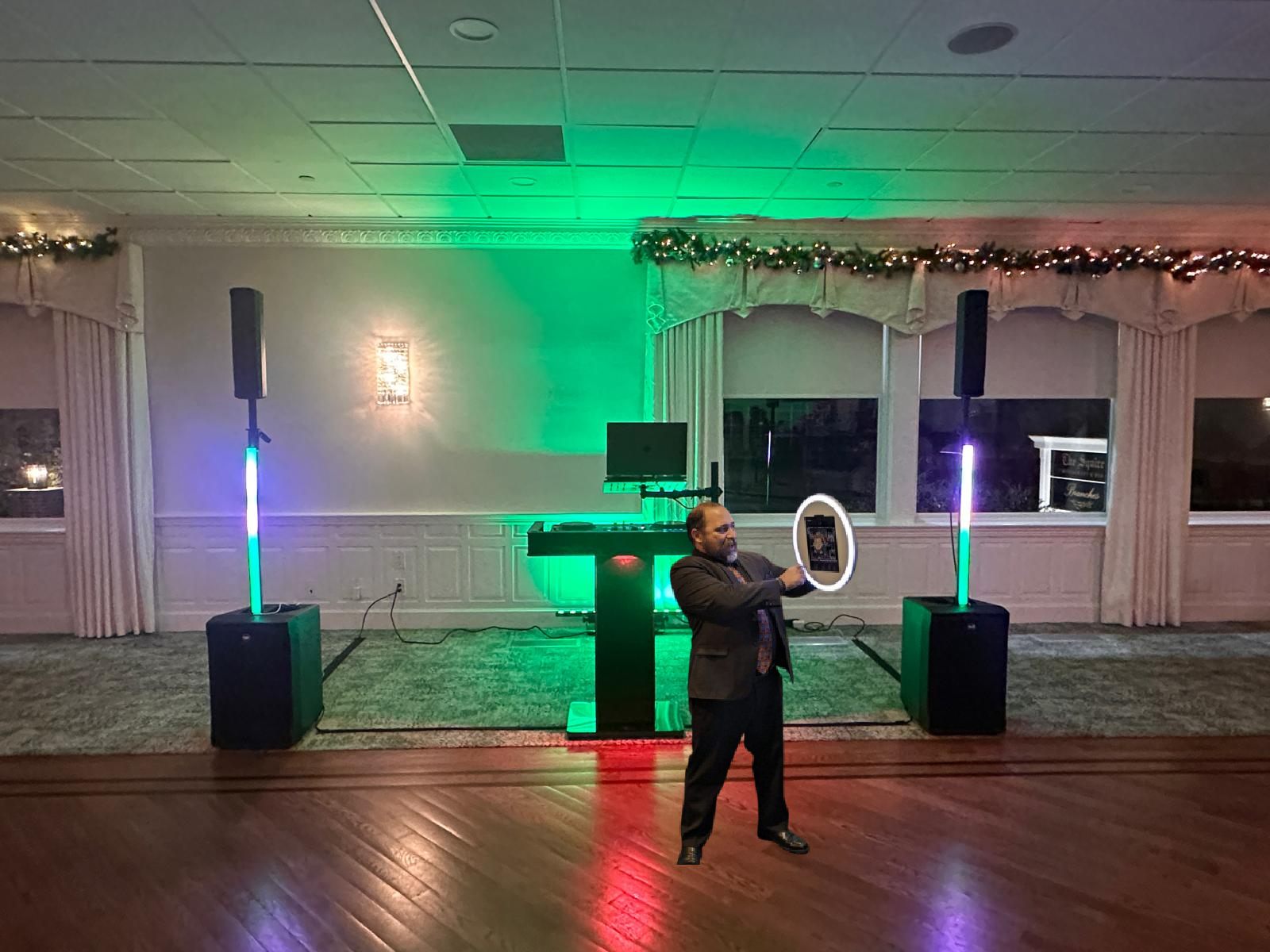 DJ sound and lighting setup with the roaming photobooth in use
