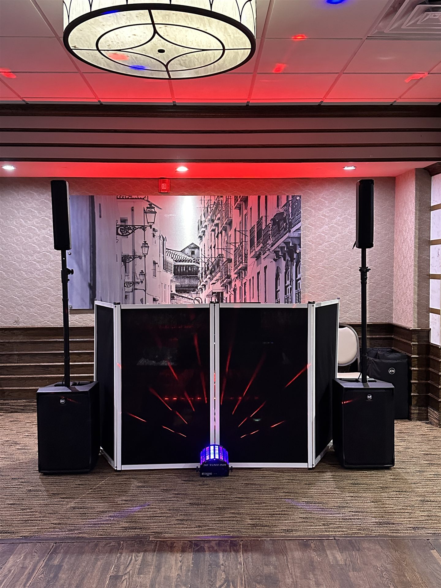 DJ facade booth with red laser lighting effects